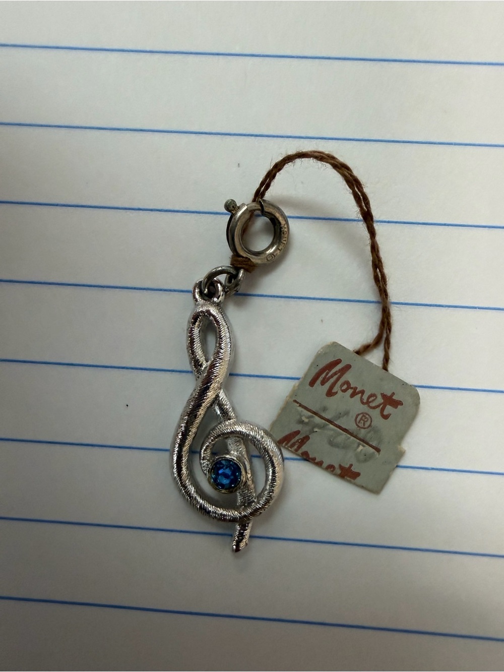 Monet Silver-Tone Treble Clef Pendant with Blue Stone